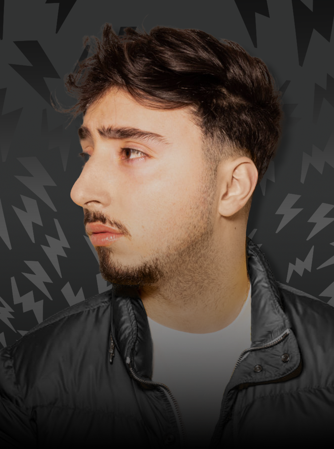 Man wearing a black jacket against a dark background with abstract patterns