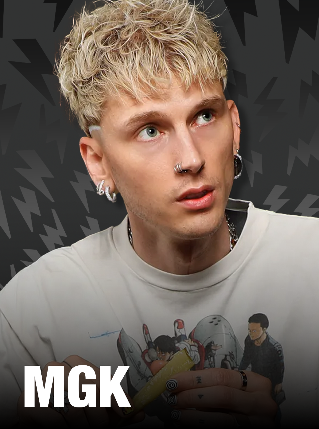 Person wearing a shirt with a graphic design and 'MGK' branding on a dark background