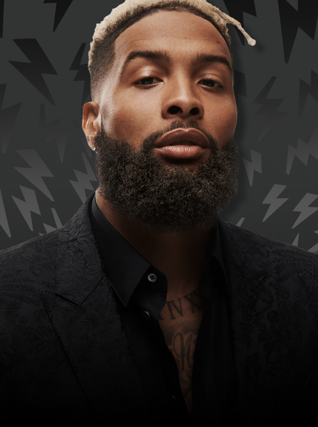 Man with a beard and tattoo on his neck against a dark background with geometric patterns